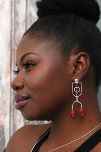 Woman wearing sterling silver krobo bead stud dangle earrings 
