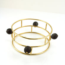 Load image into Gallery viewer, Gold toned architectural bangle bracelt with Ghanaian Krobo Beads