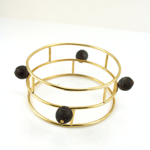 Gold toned architectural bangle bracelt with Ghanaian Krobo Beads