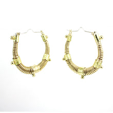 Load image into Gallery viewer, Large gold toned West African inspired statement hoop earrings